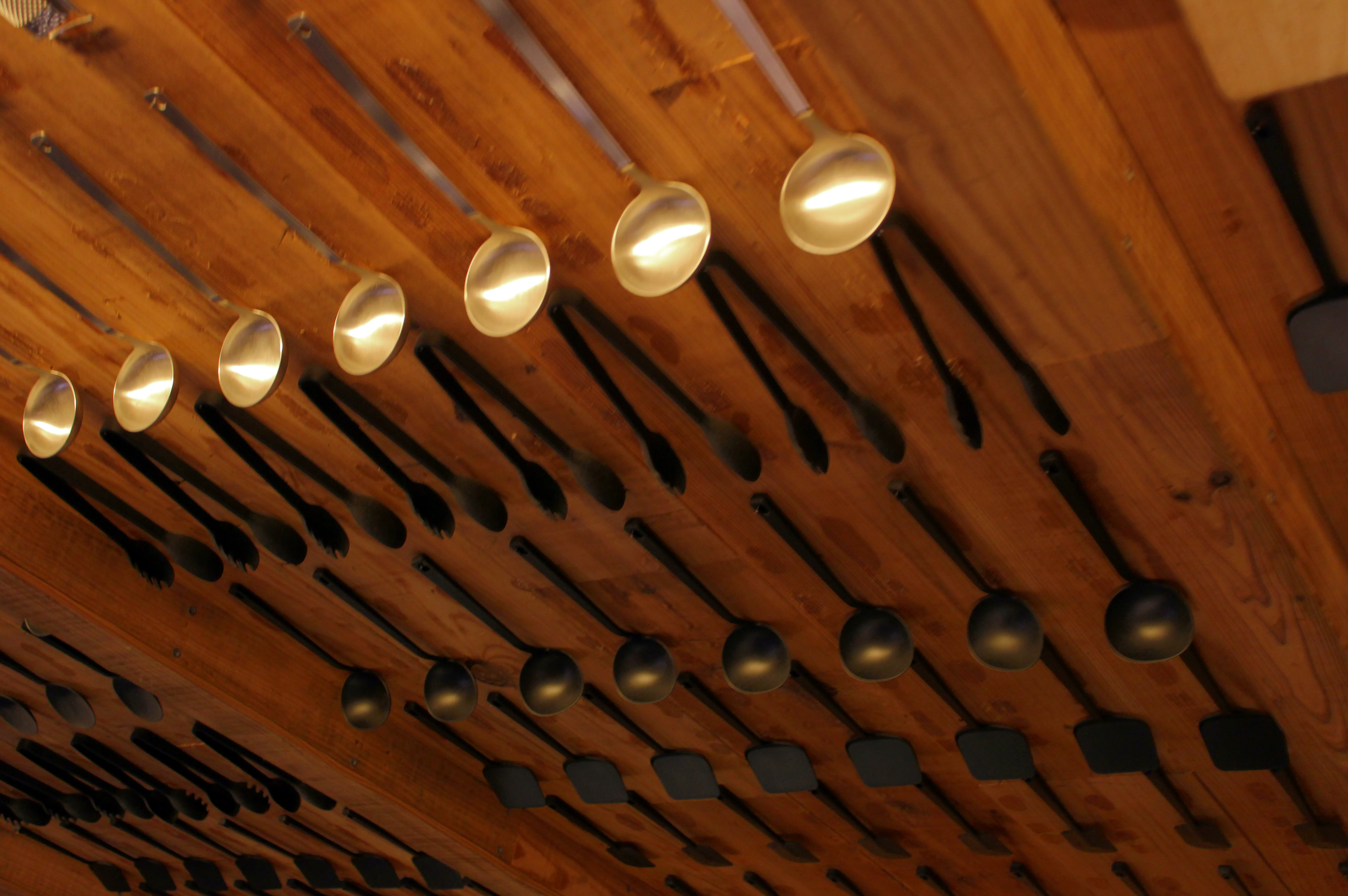 Muji&#x27;s wall of serving utensils like those huge spoons you use for handing out servings from a big pot of stew